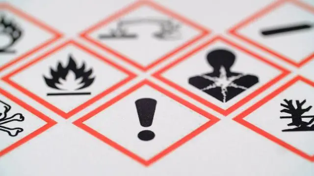 WHMIS 2025: What You Need to Know. Globally Harmonized System (GHS) chemical hazard safety pictograms inside red diamonds, featuring symbols for flame, exclamation mark, health hazard, corrosion, and environmental hazard.